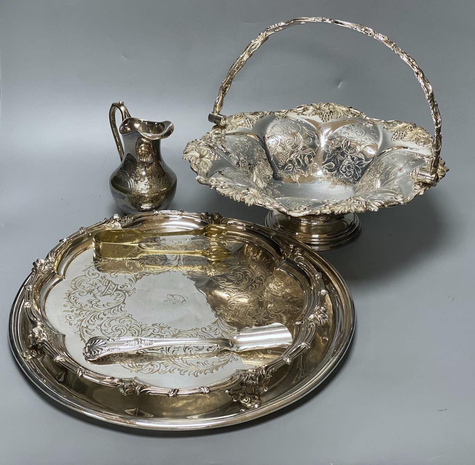 A silver plated cake basket, with cast border, diameter 31cm, two plated trays and three other items